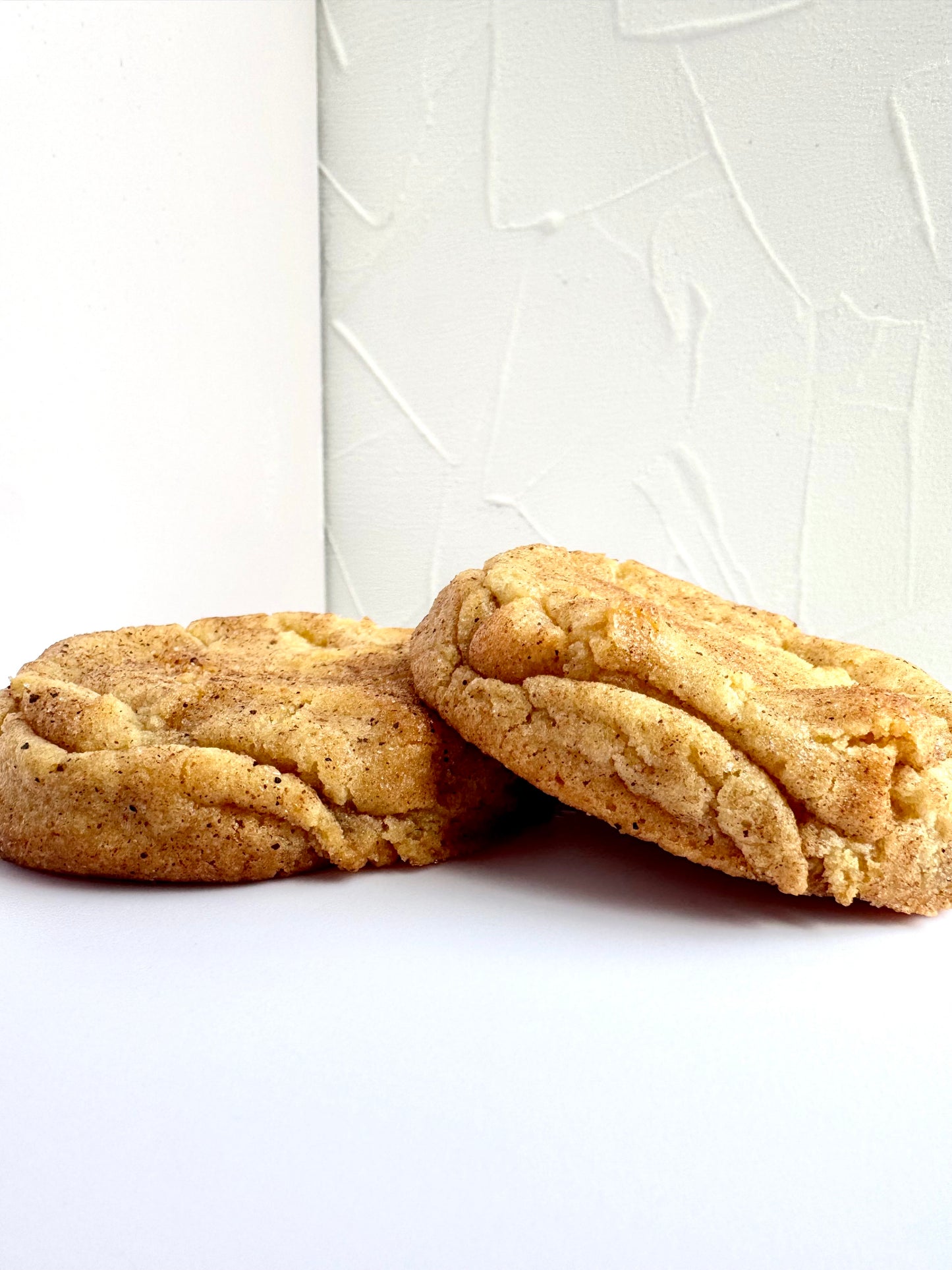 Soft and chewy snickerdoodle cookies coated in cinnamon sugar from Secret Ingredient Bakery